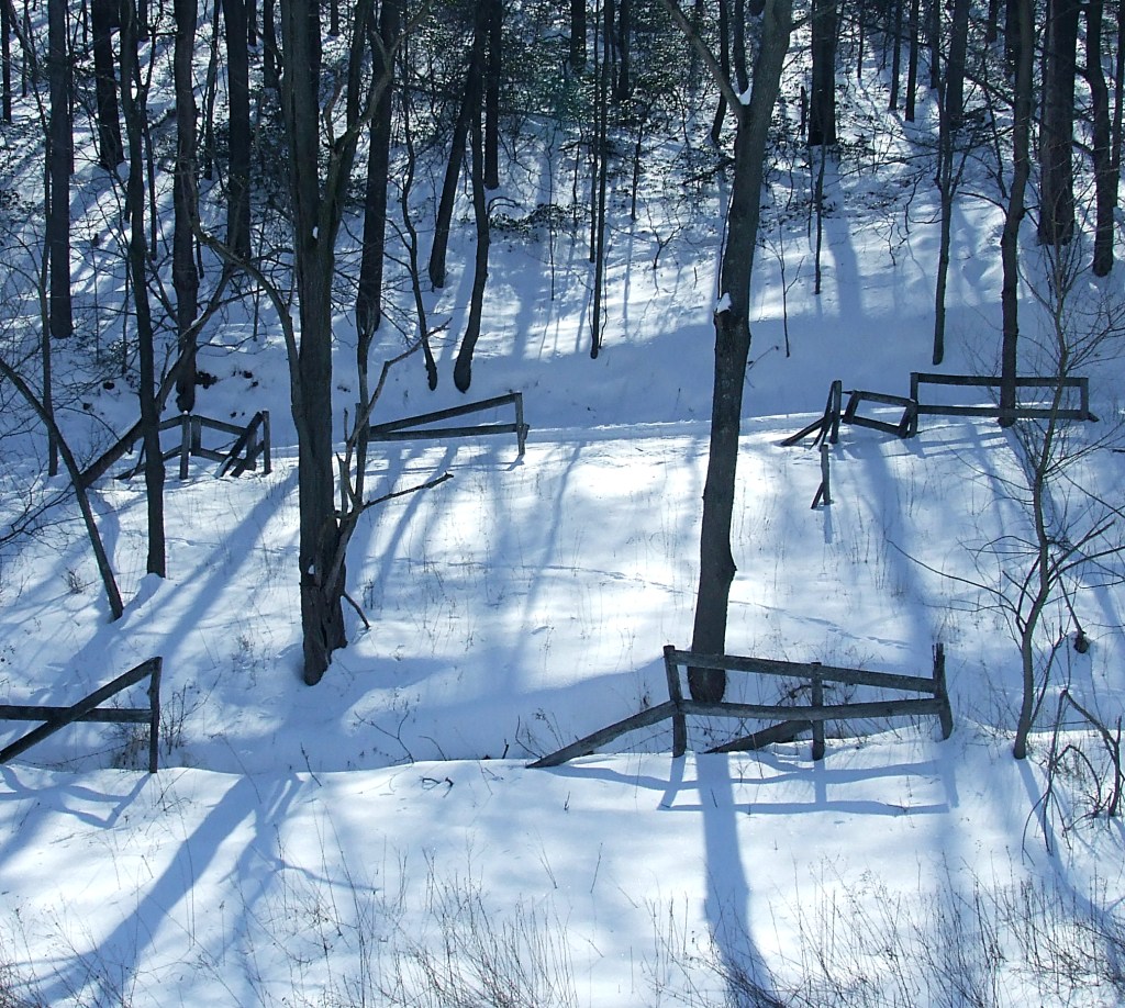 the remains of an old horse corral in the snow