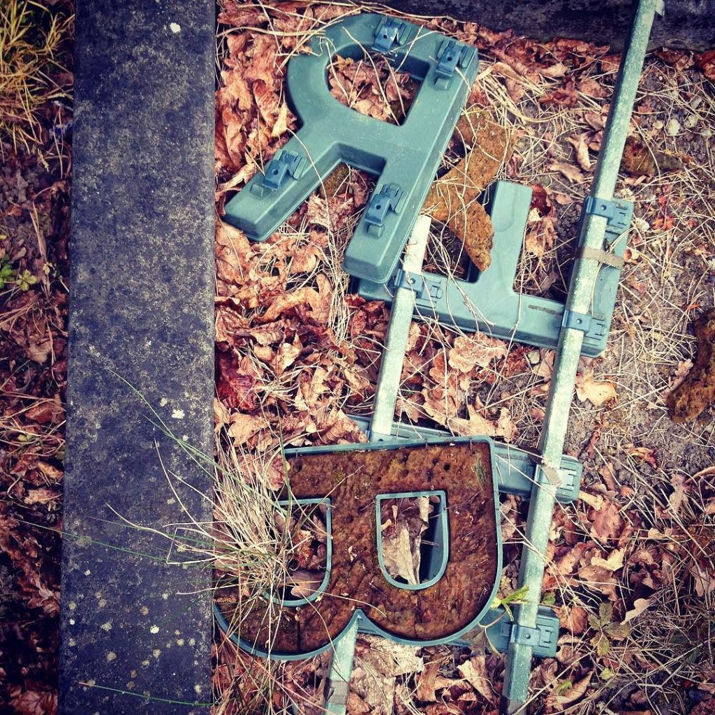 Discarded plastic letters (R, E and B) from temporary graveyard memorial displays.